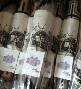 Packaged rugs and runners. Each piece comes with a hand printed Cabin' tote bag
