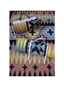 Peaks' rug and Elements' patchwork quilt and duffel bag in the acid colour way.