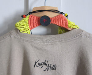 Arrow stitched leather button and Knight Mills back neck print.