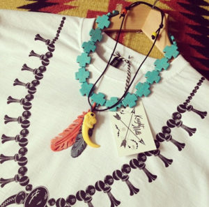 Squash blossom' tee styled with hand made necklaces.
